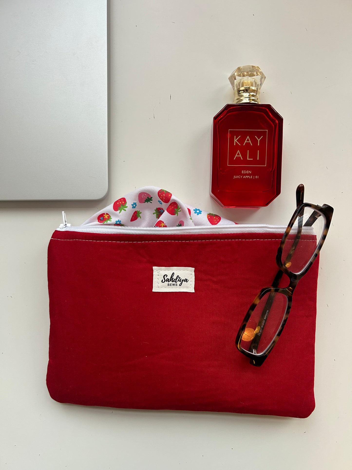 Red quilted pouch | Strawberry print lining makeup bag | Cosmetic pouch | Travel essentials organiser