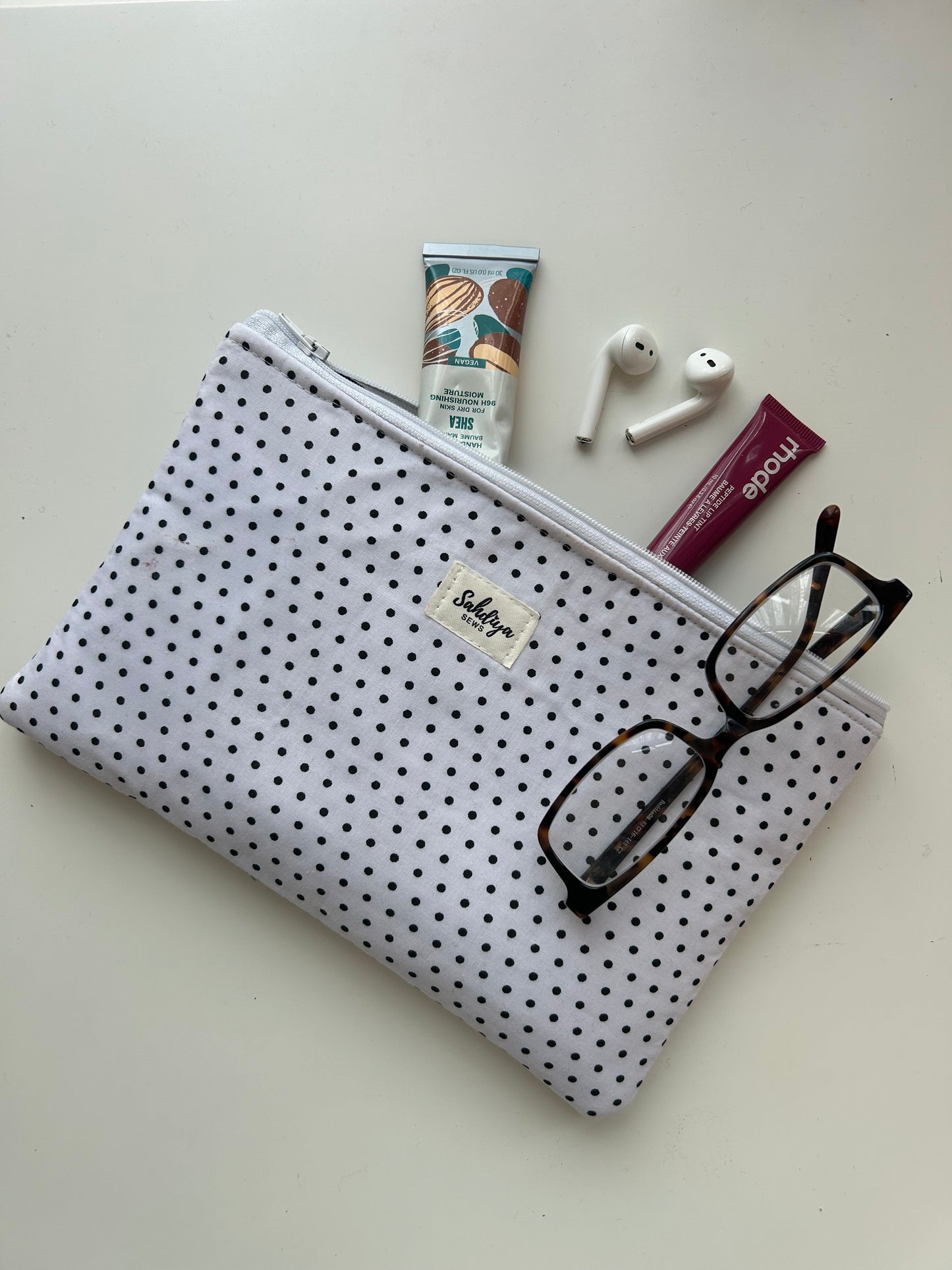 Polka dot quilted makeup pouch | White & black cosmetic bag | Everyday essentials organiser | Travel beauty pouch