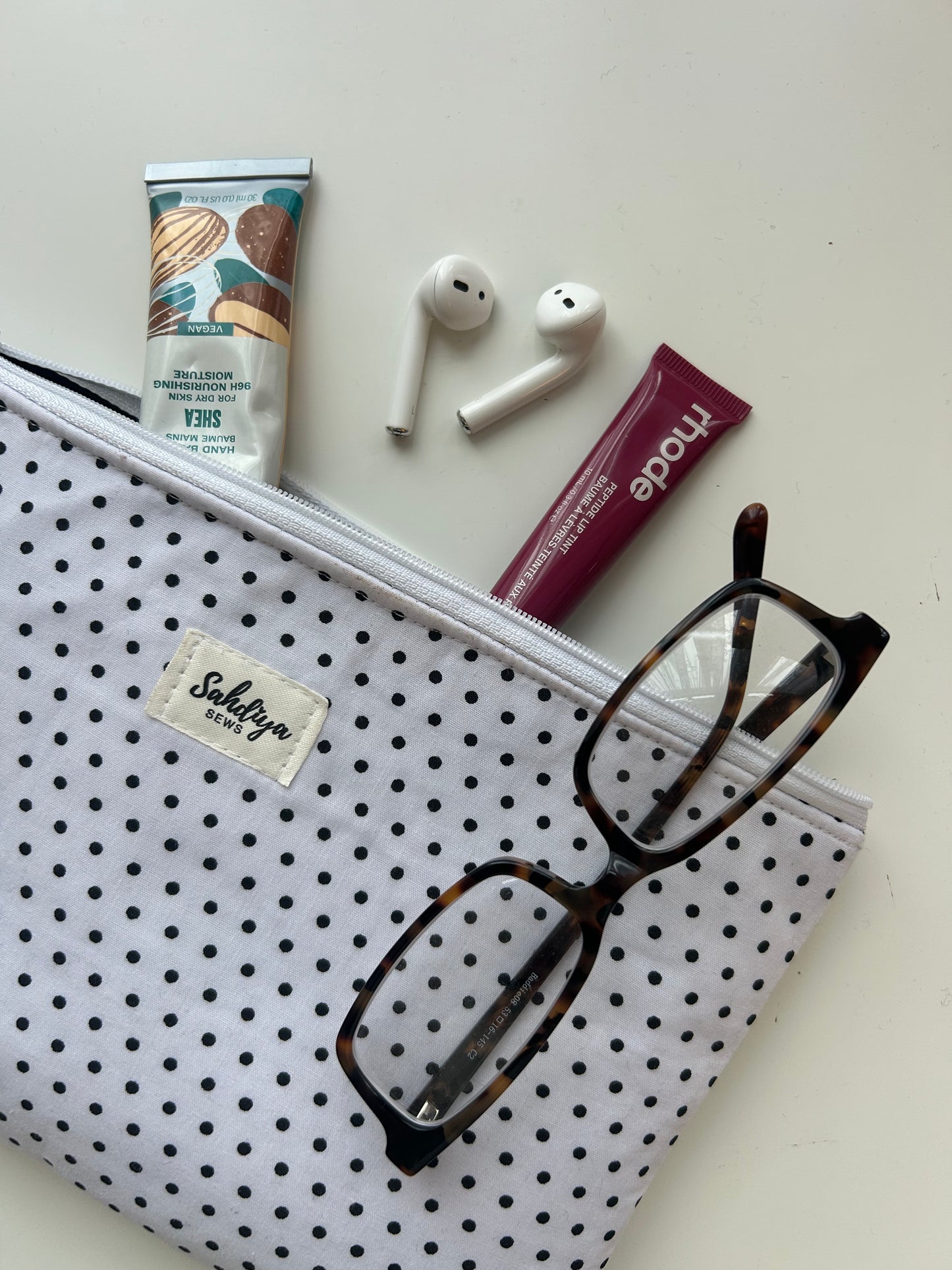 Polka dot quilted makeup pouch | White & black cosmetic bag | Everyday essentials organiser | Travel beauty pouch