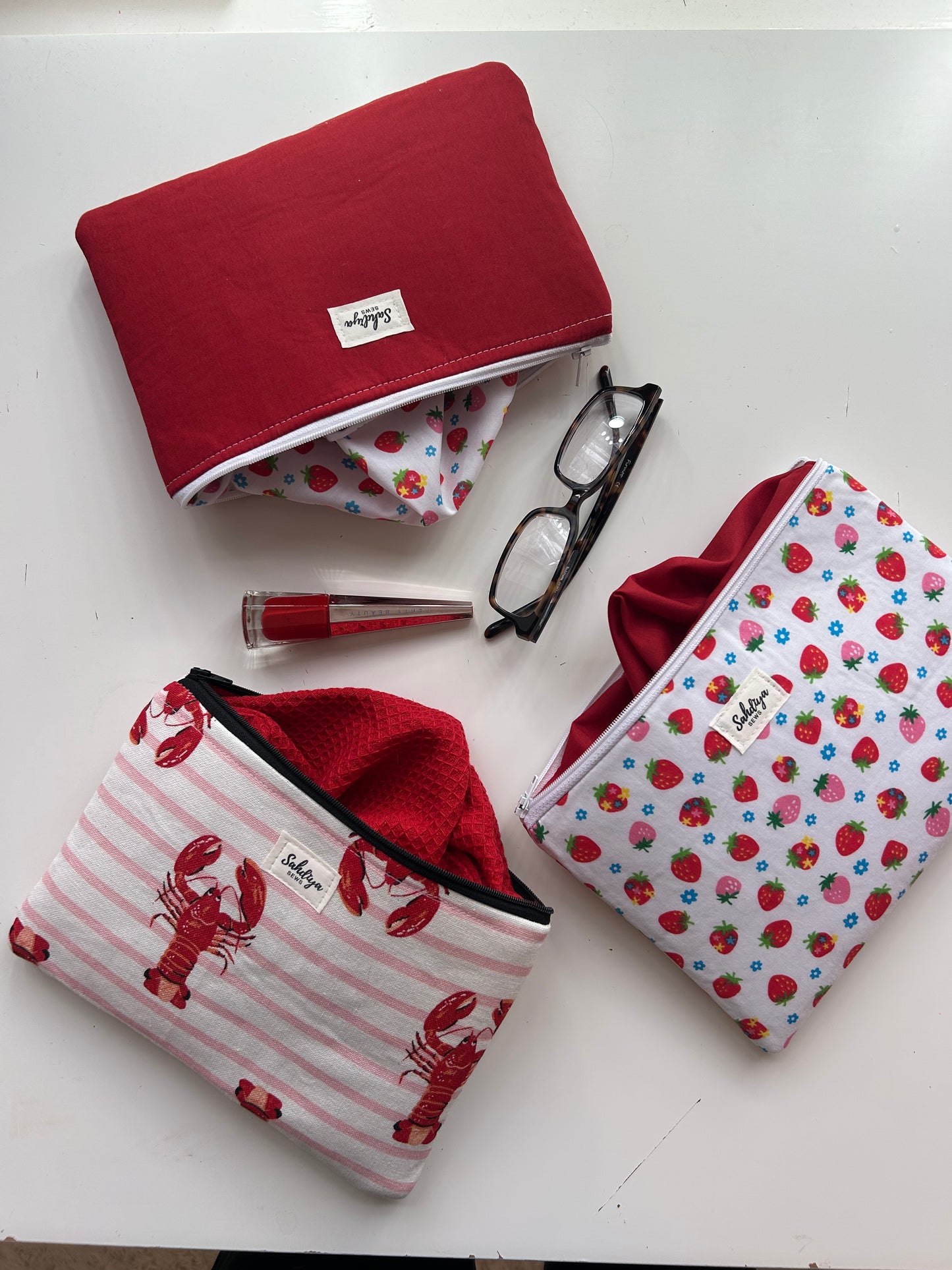 Red quilted pouch | Strawberry print lining makeup bag | Cosmetic pouch | Travel essentials organiser